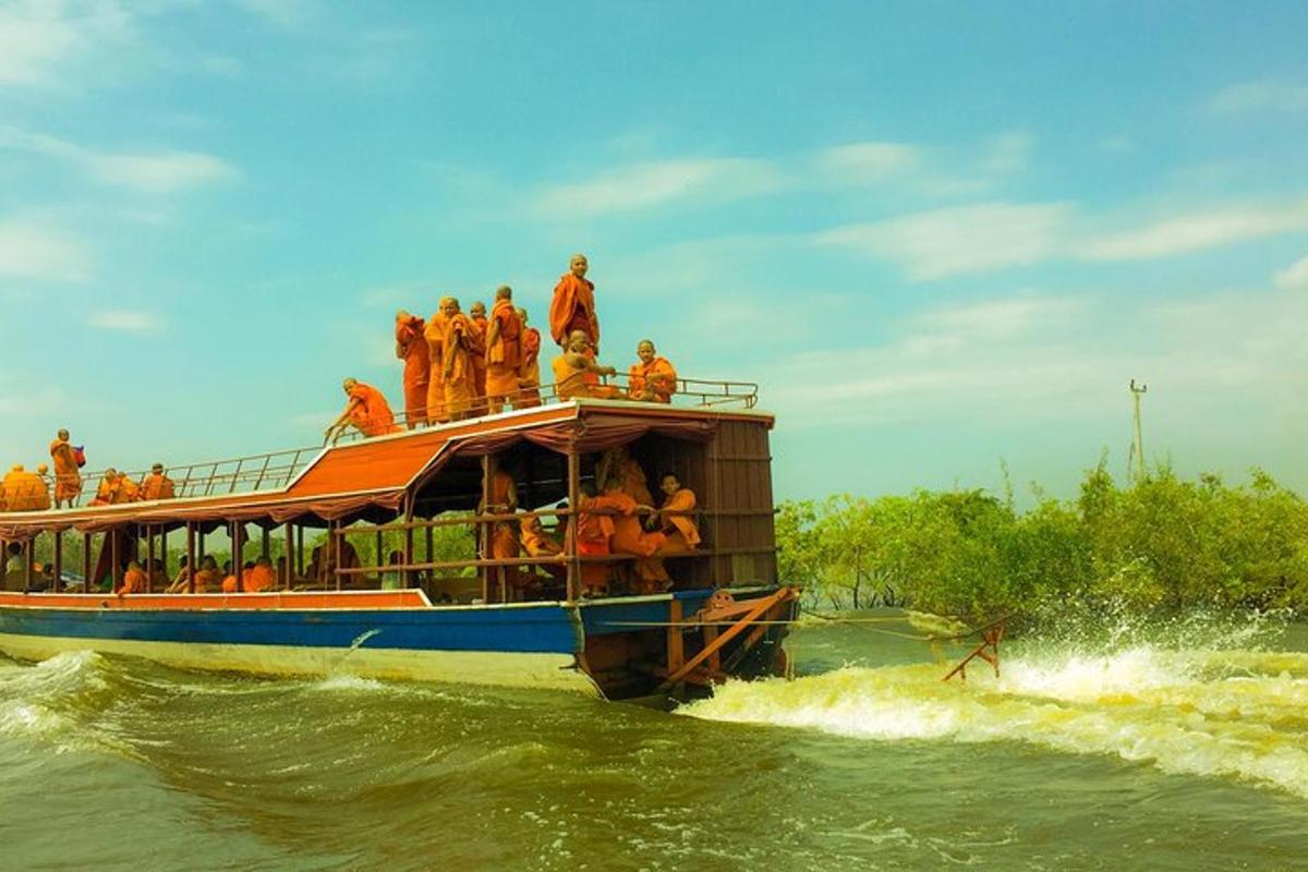 a group of people on a boat in the water