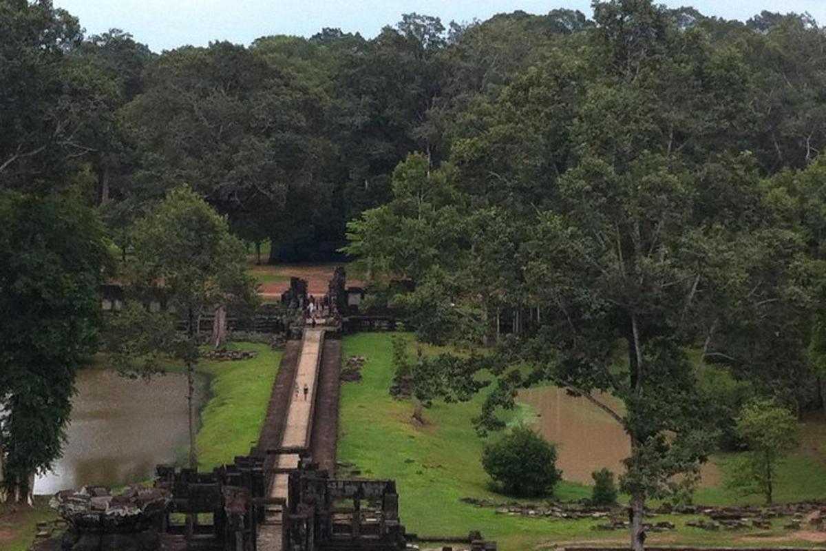 a bridge over a river with people walking on it