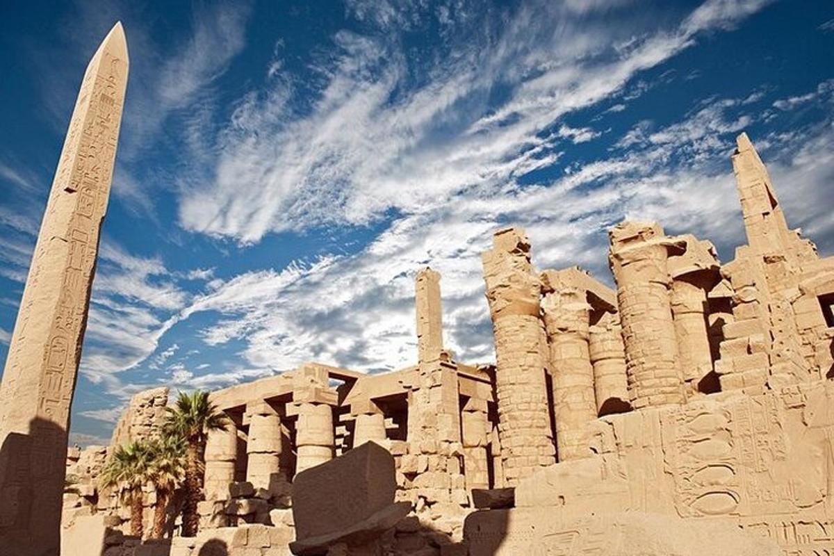 a building with a obelisk in front