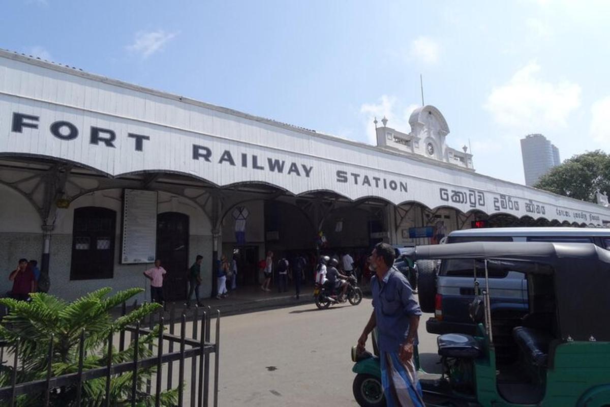 a man walking in front of a train station