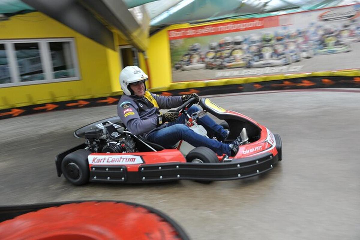 a man riding a four wheeler on a track