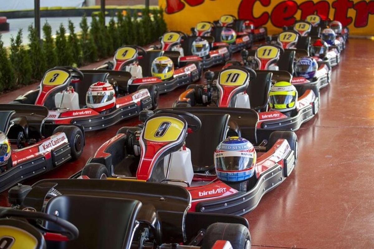 a row of small toy cars in a theme park