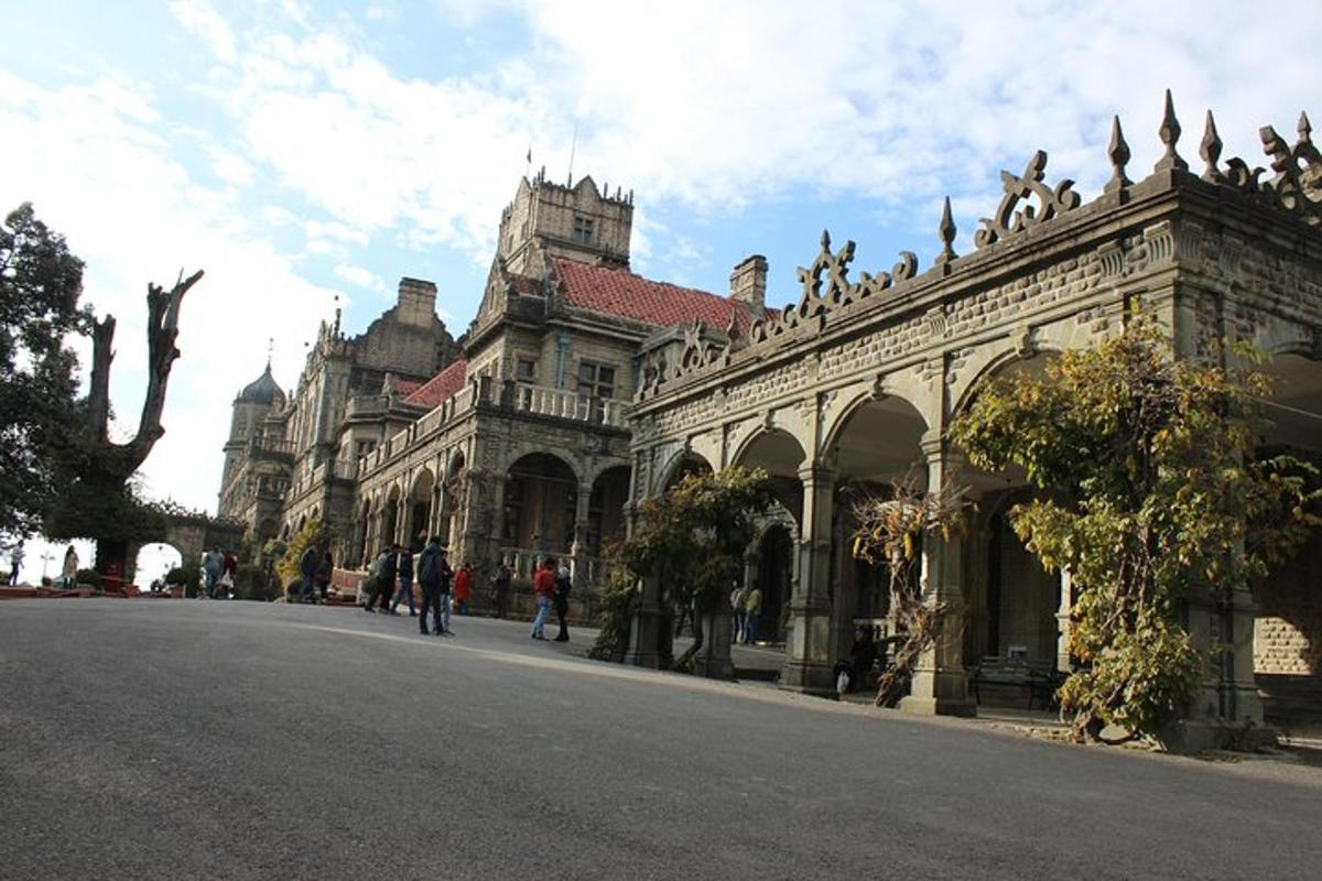 a large building with people walking on a street