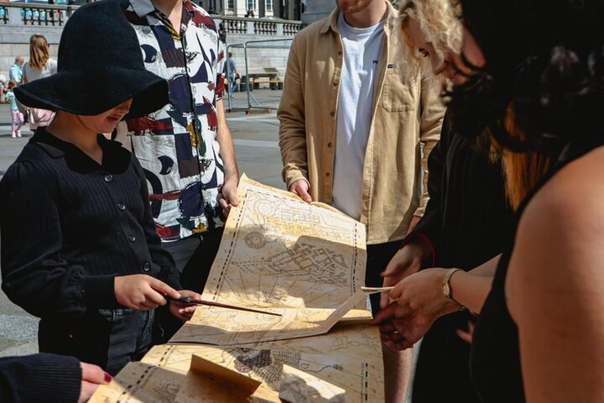 a group of people standing around a map