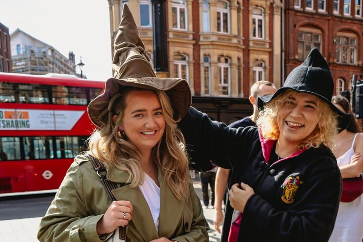 two women wearing witches hats on a city street