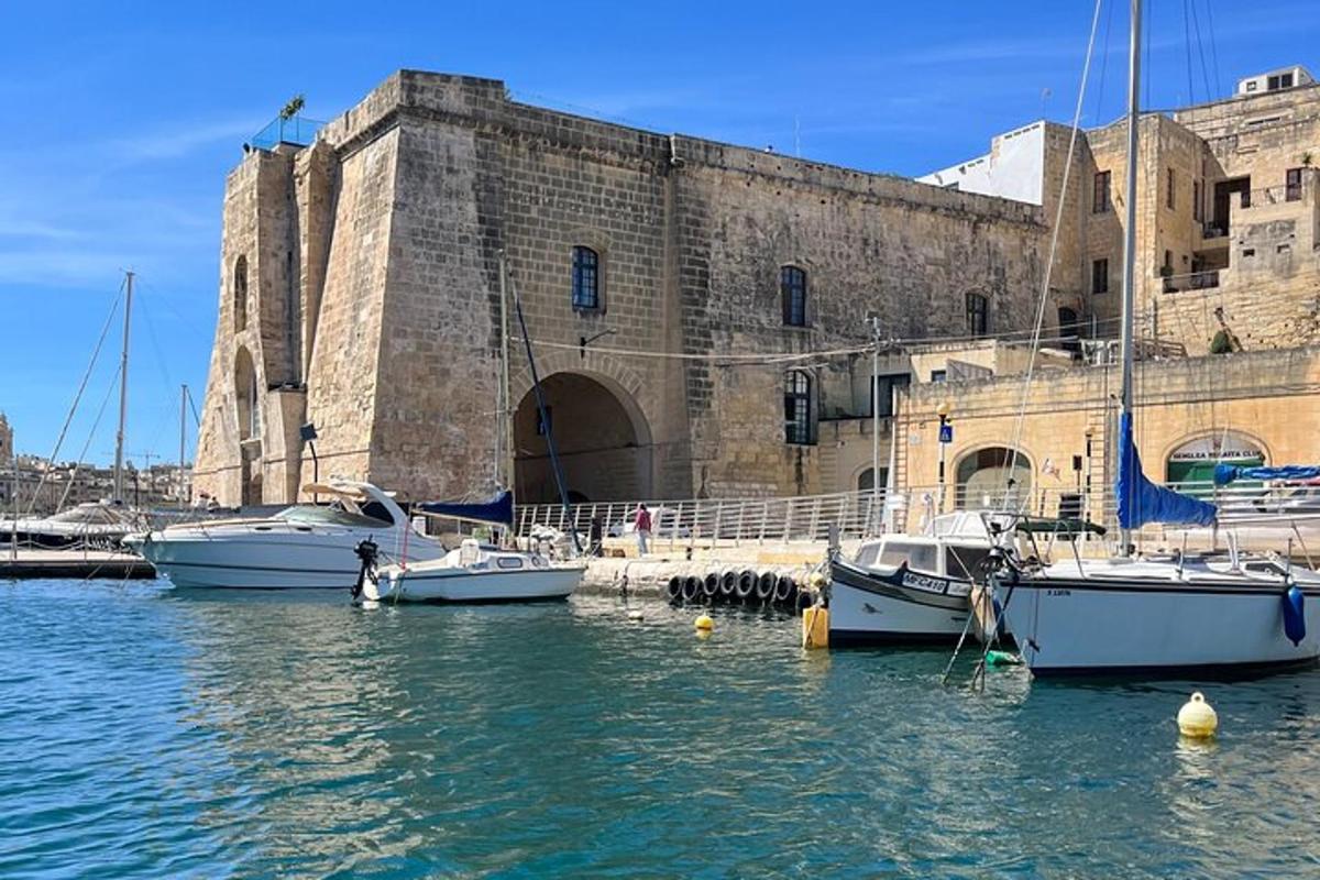 a group of boats in the water in front of a building