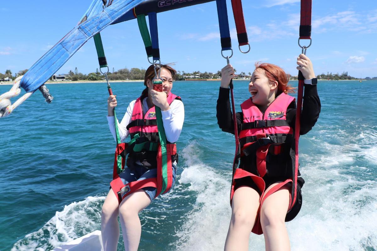 two girls are on the water on the water
