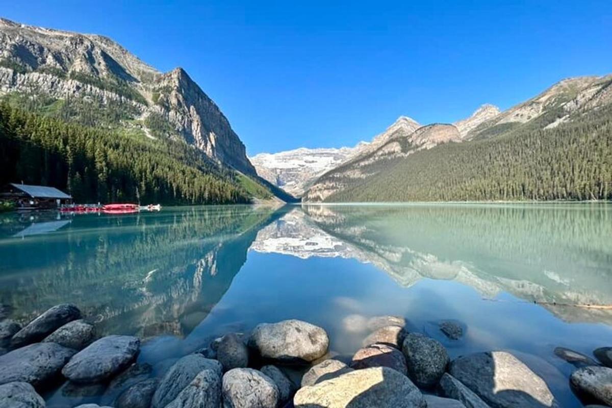 a view of a lake with trees and mountains