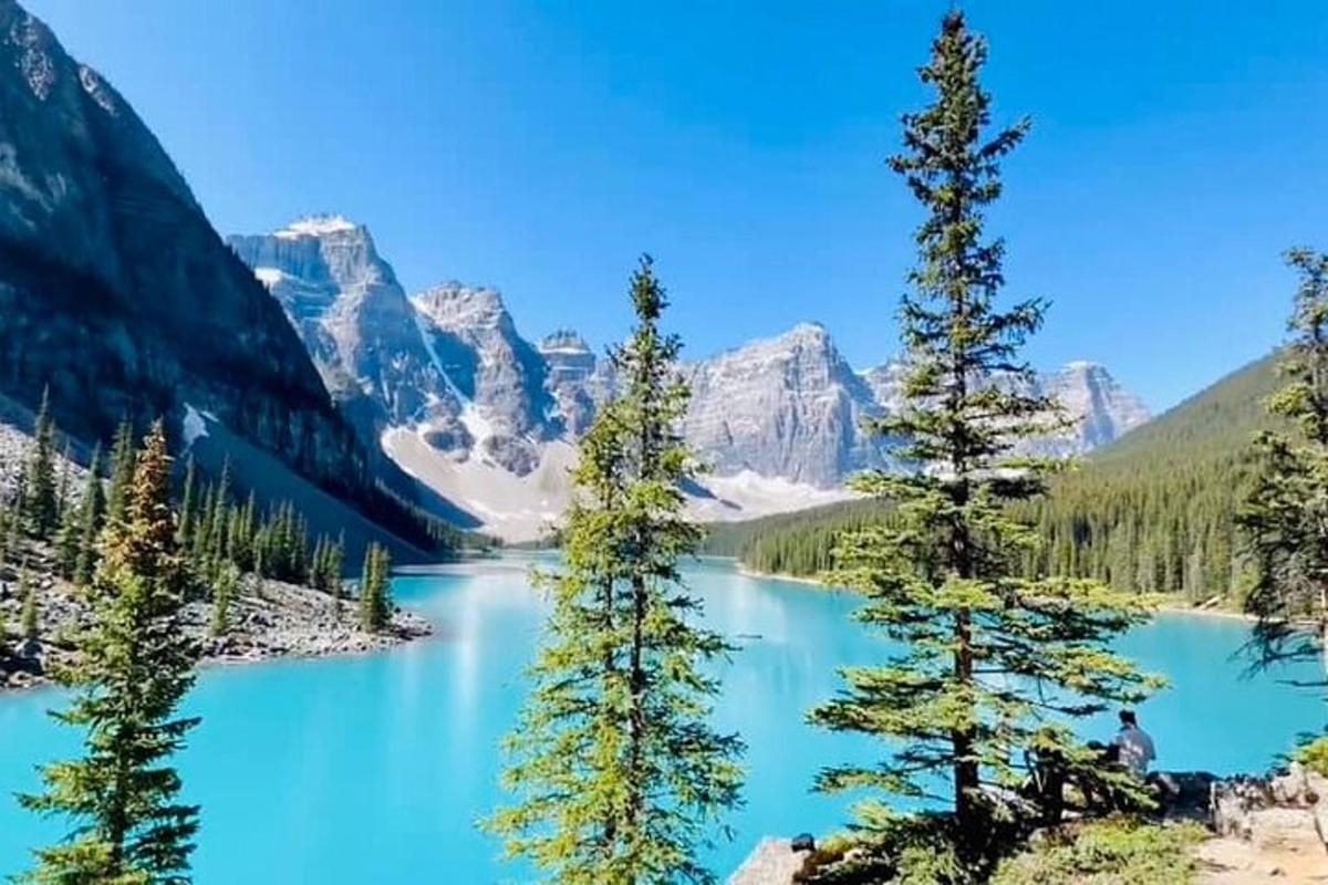 a view of a blue lake in the mountains