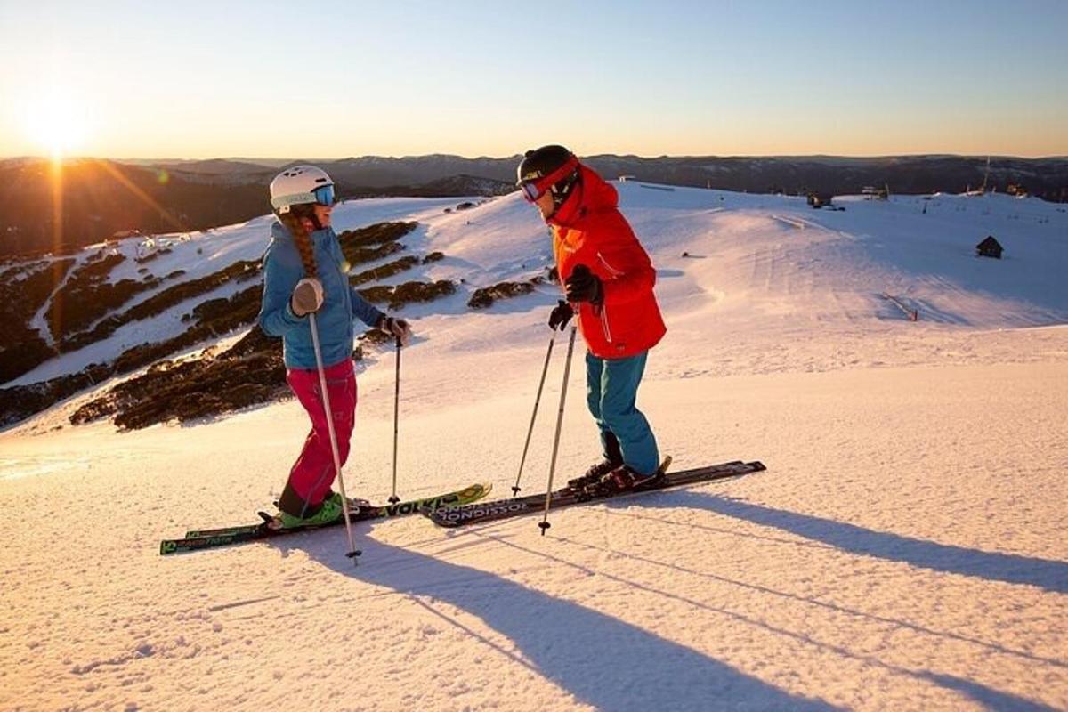 dalawang tao sa skis sa isang snow covered slope