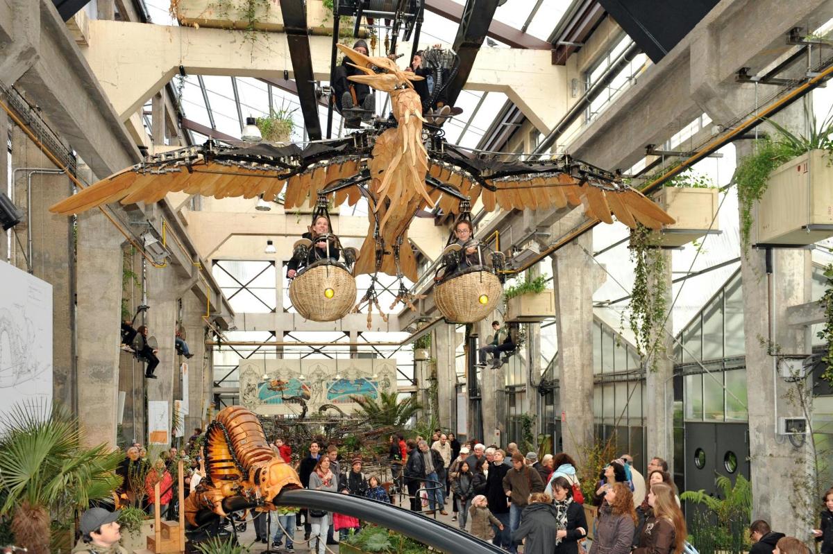 a museum with a dinosaur hanging from the ceiling