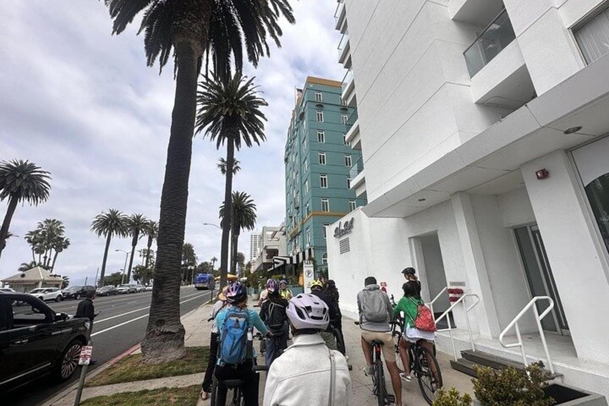 a group of people riding bikes down a street