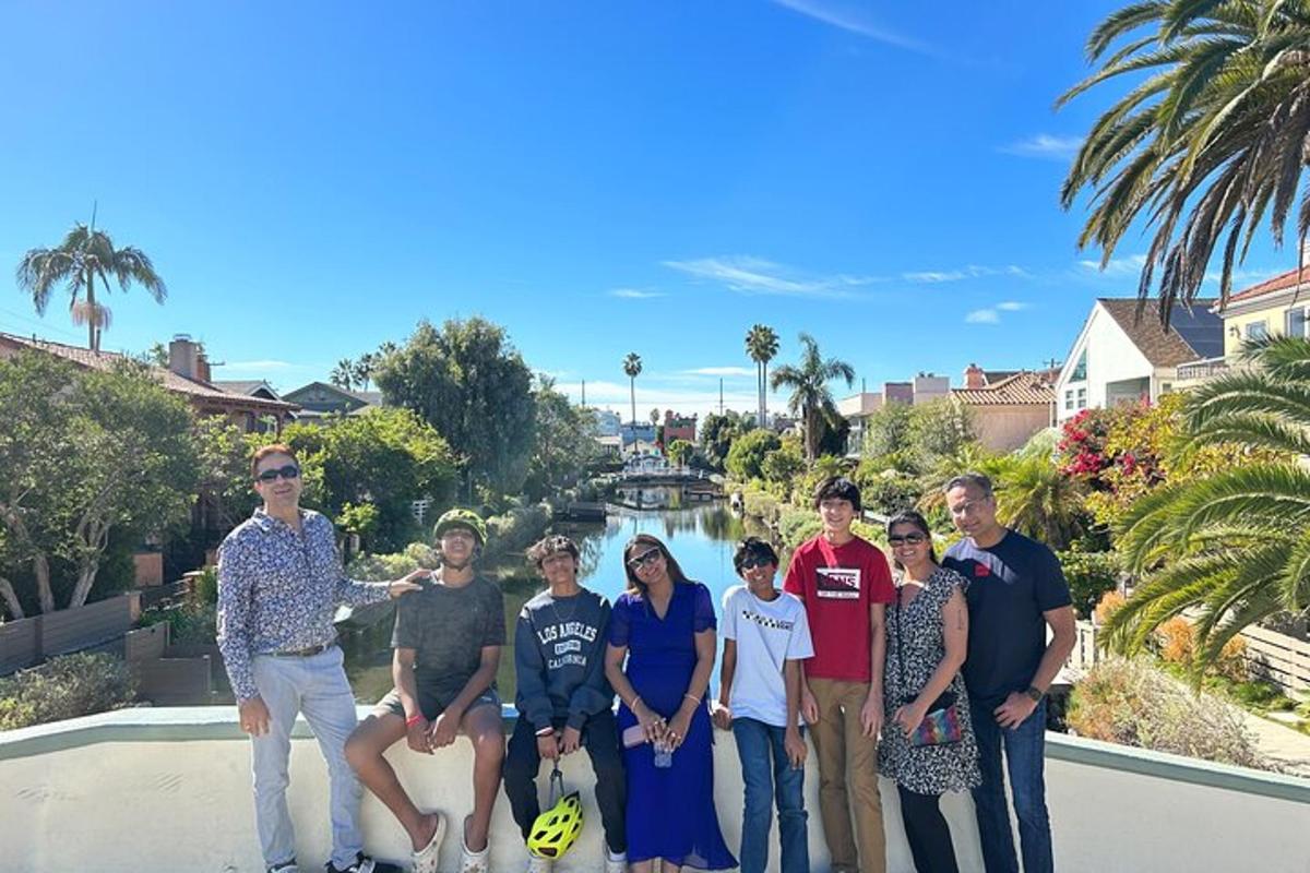 a group of people posing for a picture in front of a river