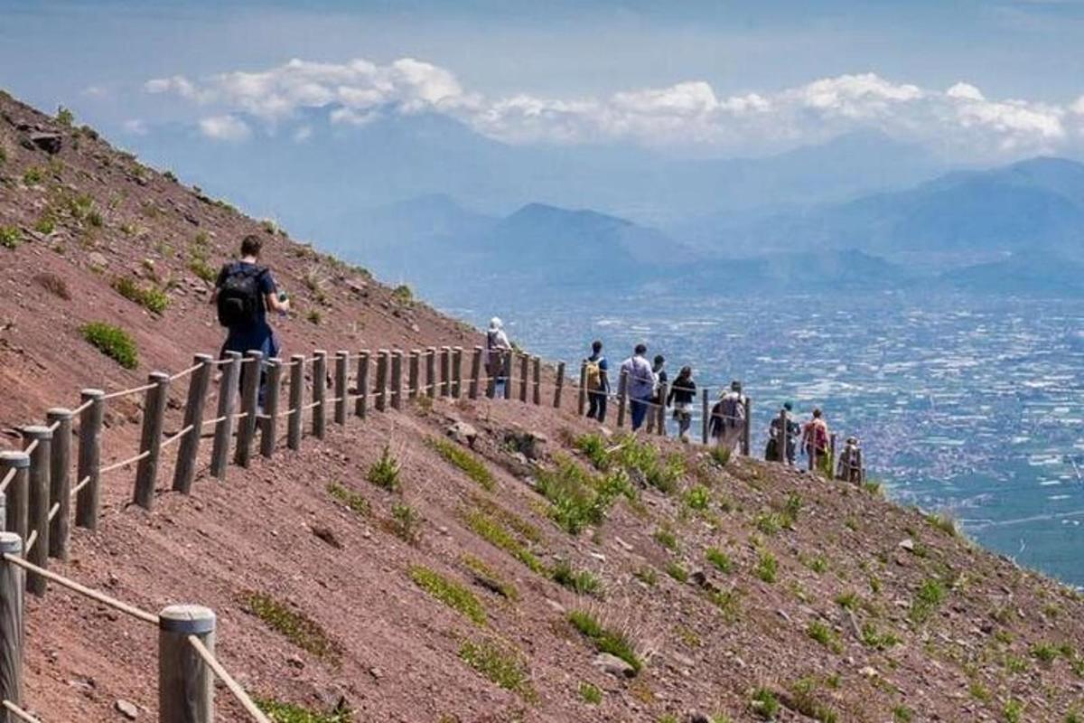 a group of people standing on top of a hill