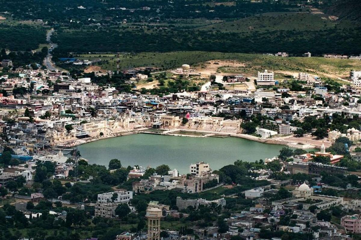 an aerial view of a city with a body of water