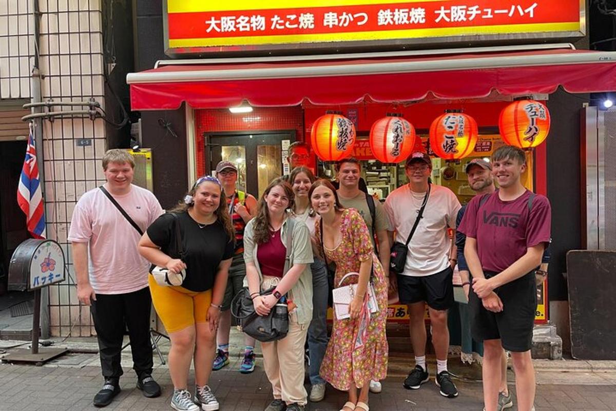 a group of people standing in front of a restaurant