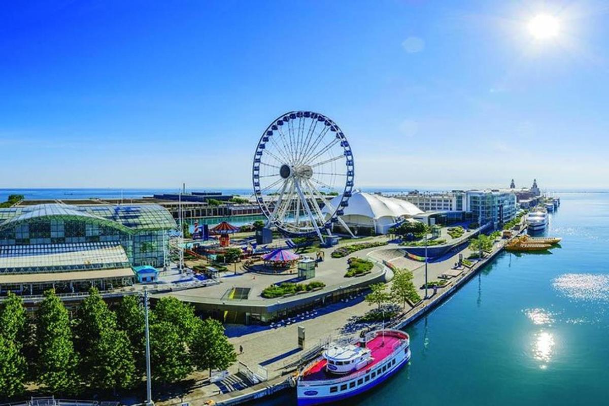 a ferris wheel in a marina with boats in the water