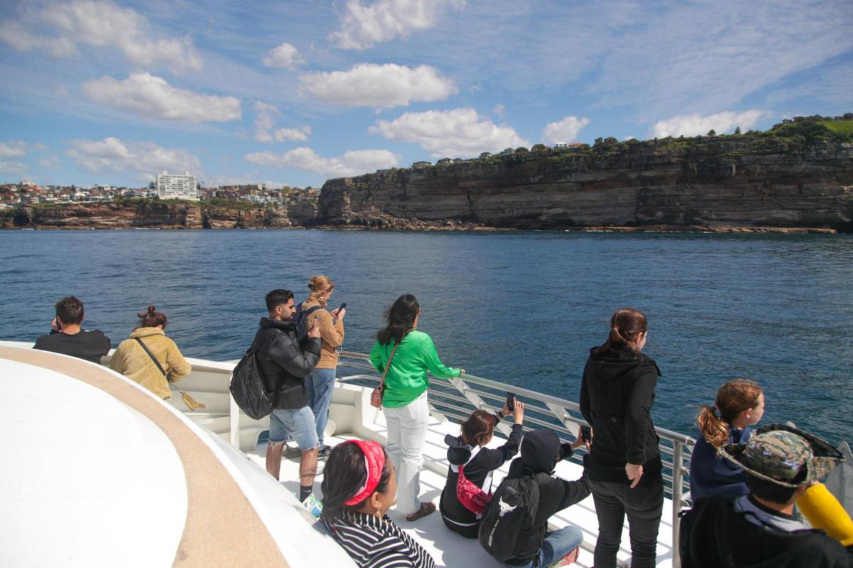 a group of people on a boat in the water