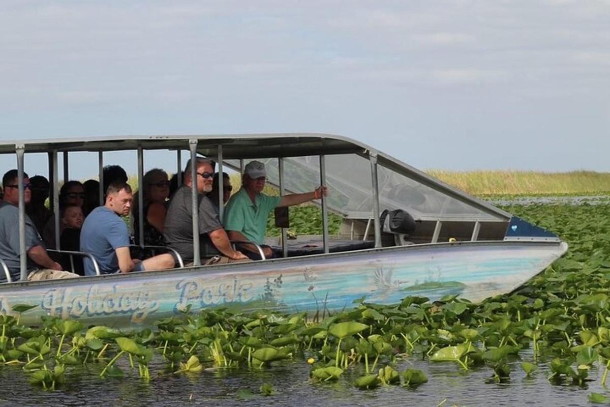 a group of people in a boat in the water
