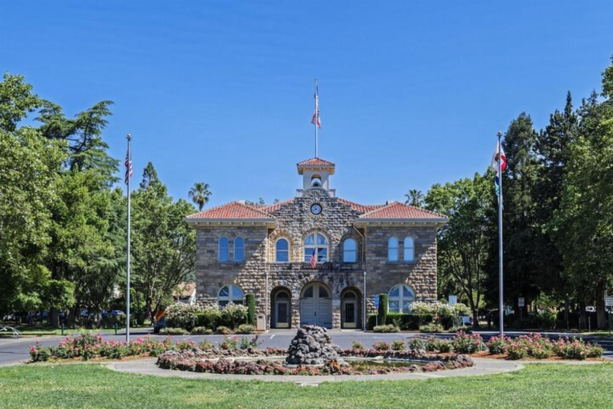 a stone building with a flag on top of it