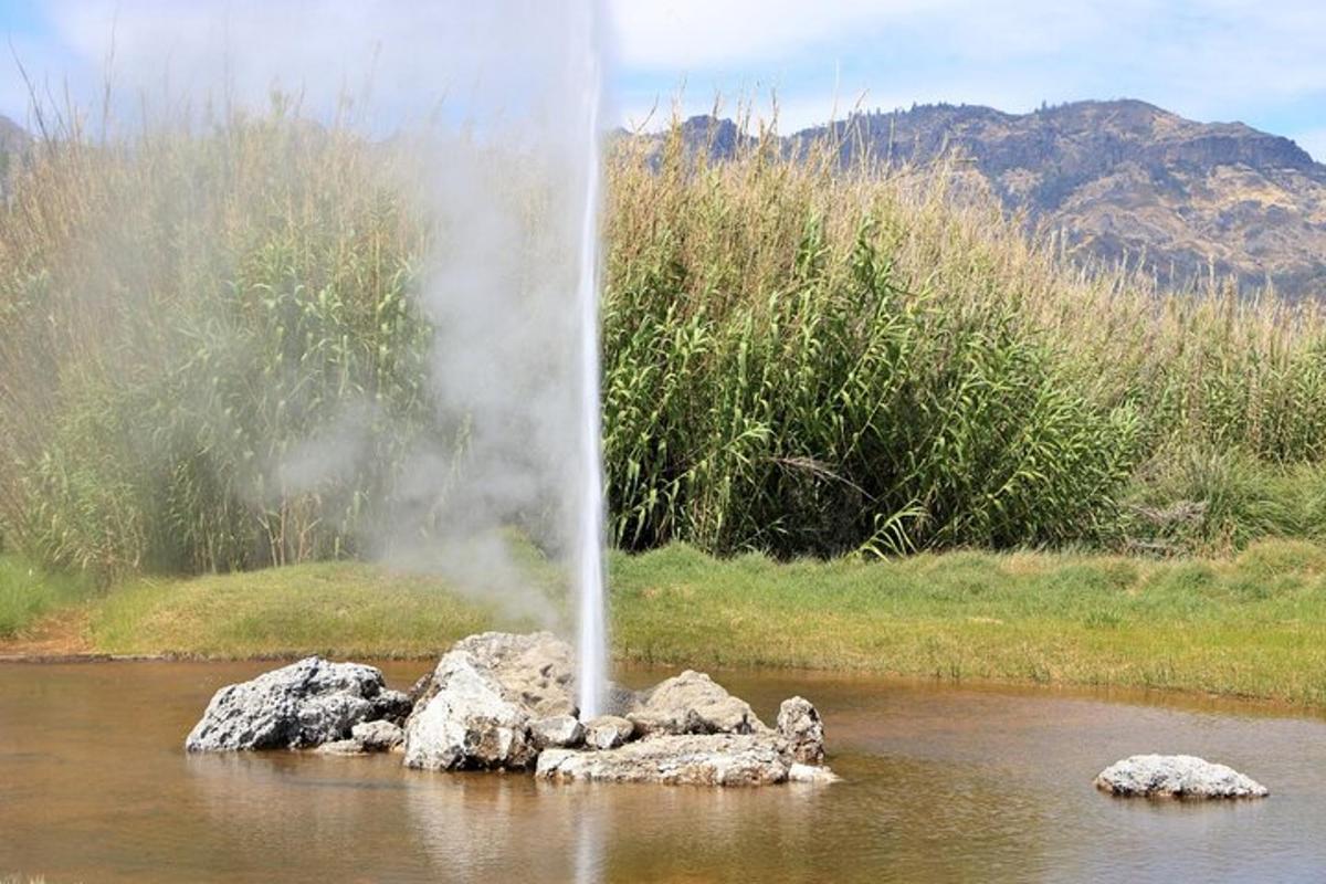 a fountain in the middle of a body of water