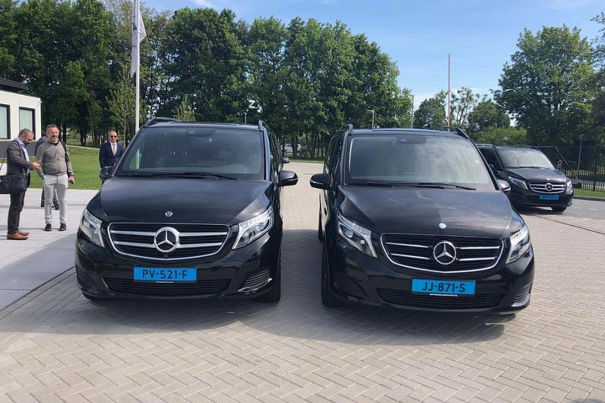 two black cars parked next to each other