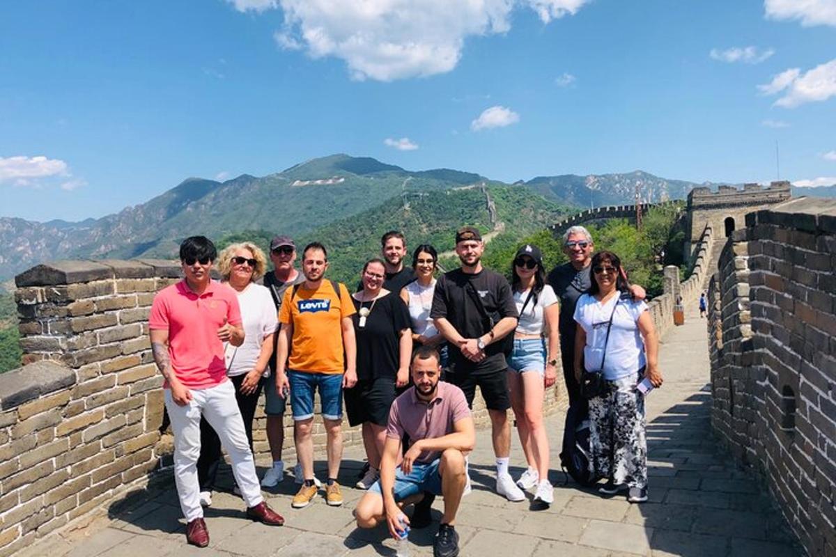 a group of people standing on the great wall