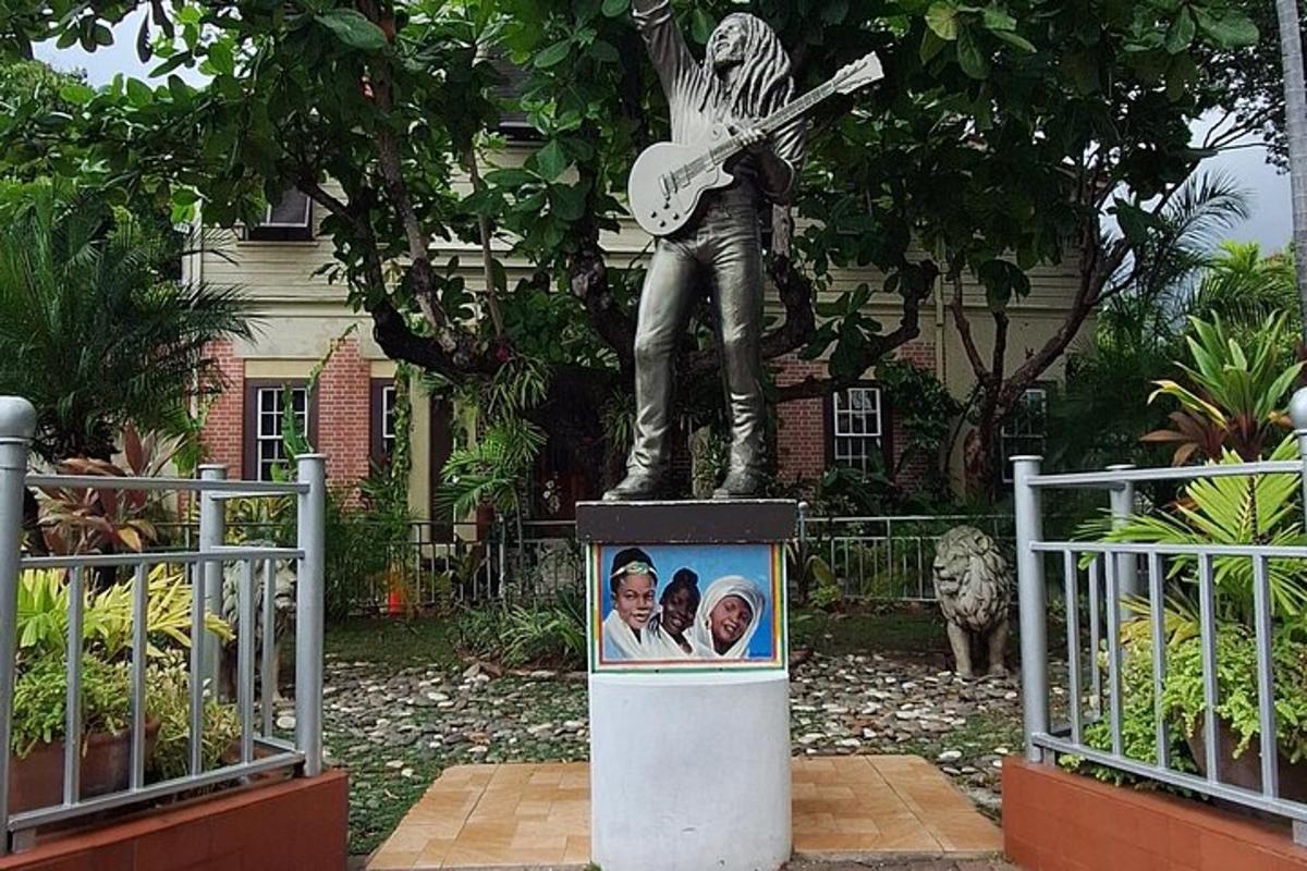 a statue of a man playing a guitar
