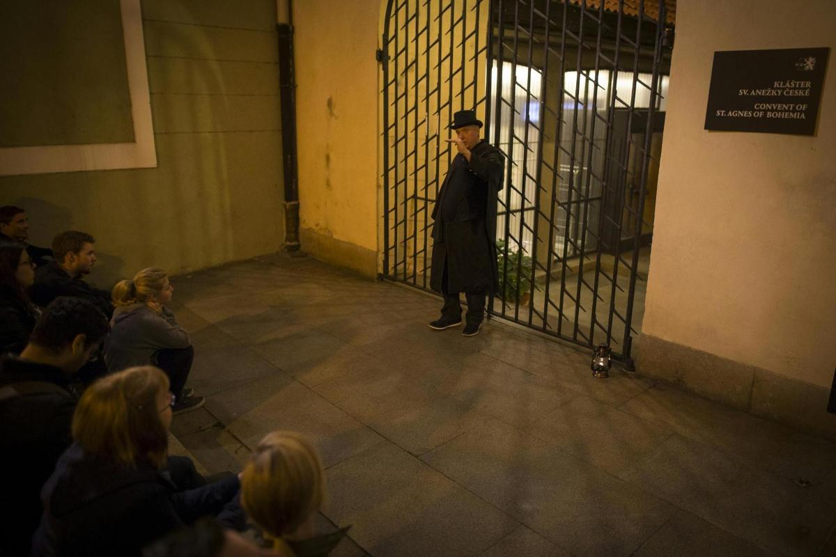 a man standing in front of a cage