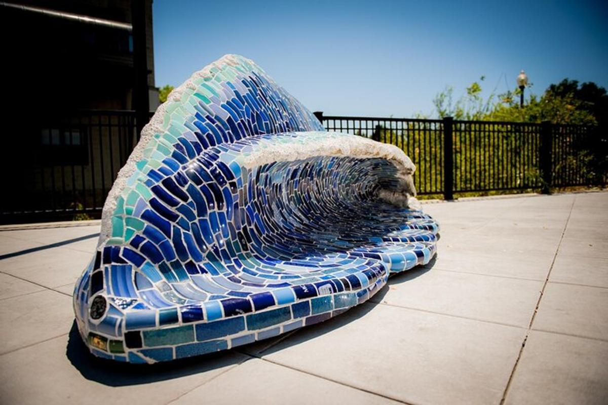 a sculpture of a whale head sitting on a sidewalk