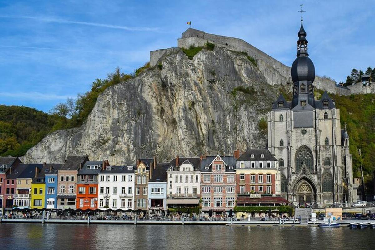 a group of buildings in front of a mountain