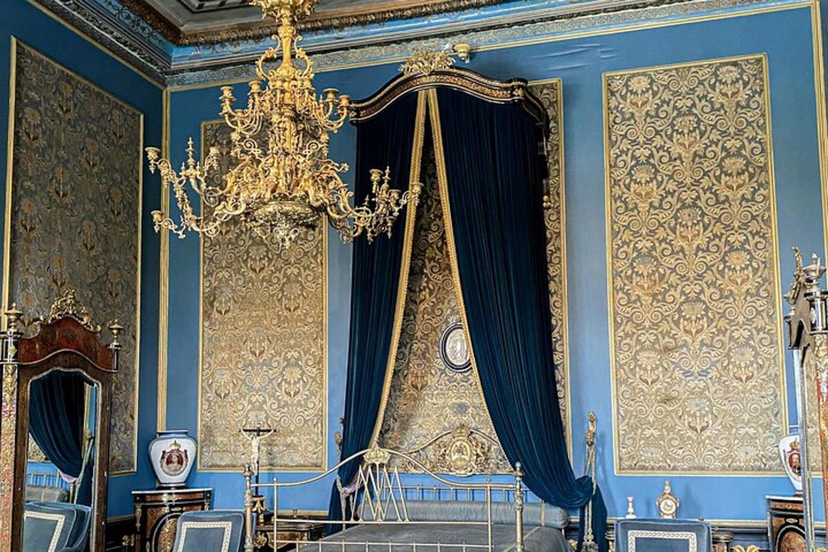 a blue room with a chandelier and blue walls