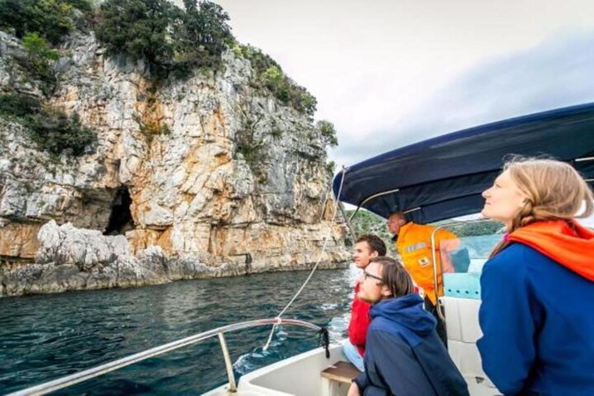 a group of people on a boat in the water