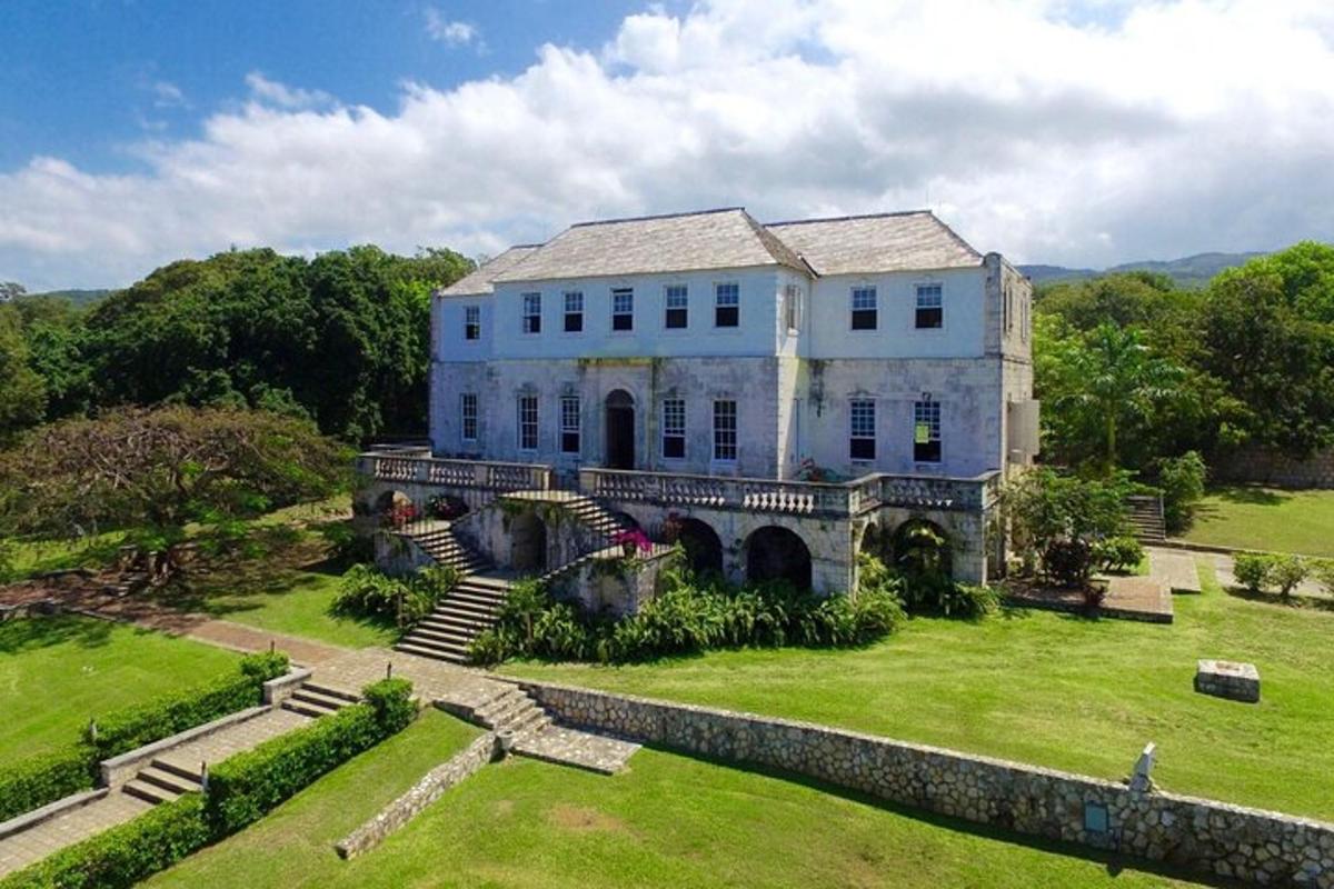 a large house on a grassy field with