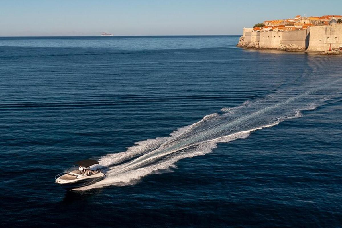 a boat in the water with a wake