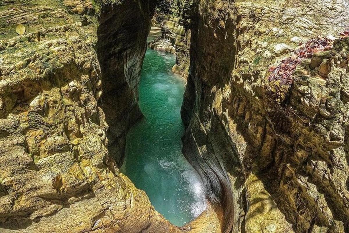 a pool of water in a rocky canyon