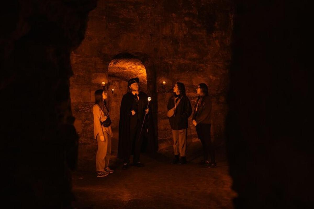 a group of people standing in a dark tunnel