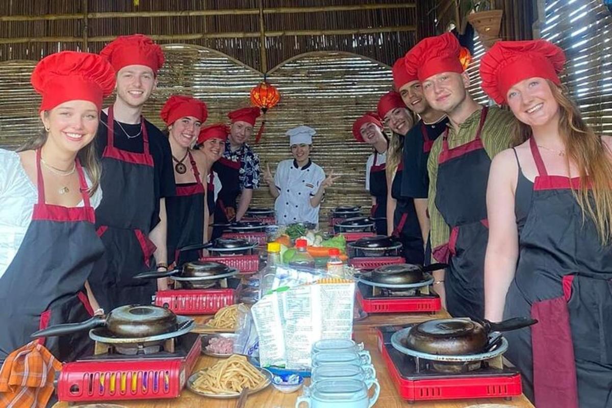a group of people wearing hats standing in front of a table with food