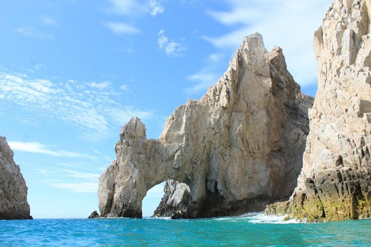an arch in the rocks in the ocean