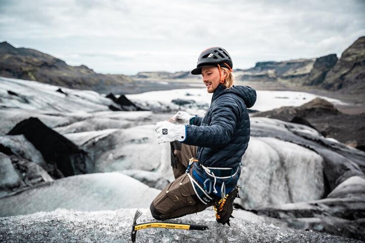 a man standing on top of a glacier