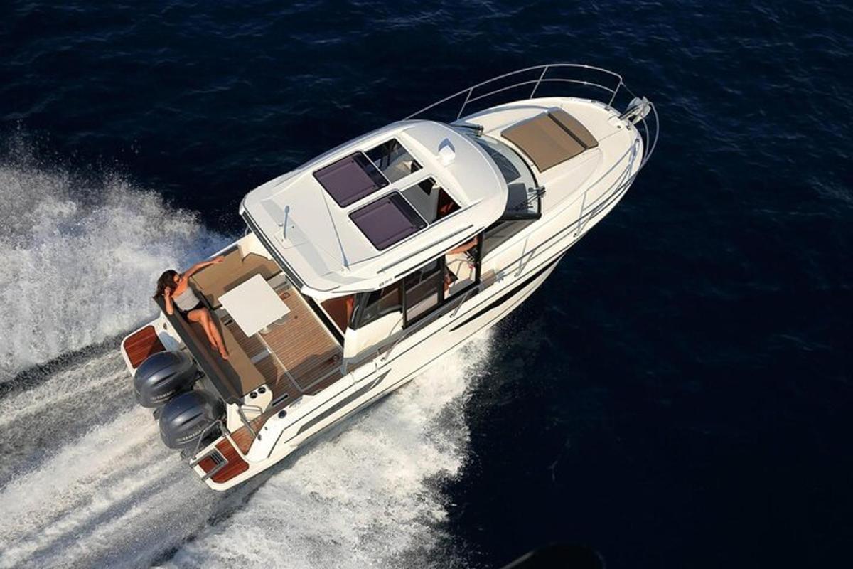 a white boat in the water on the ocean