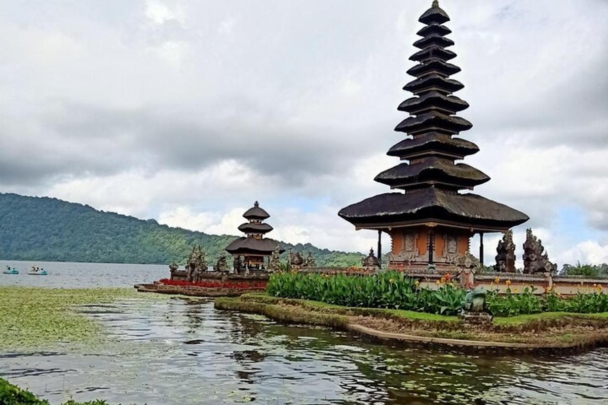 two pagodas in the middle of a body of water