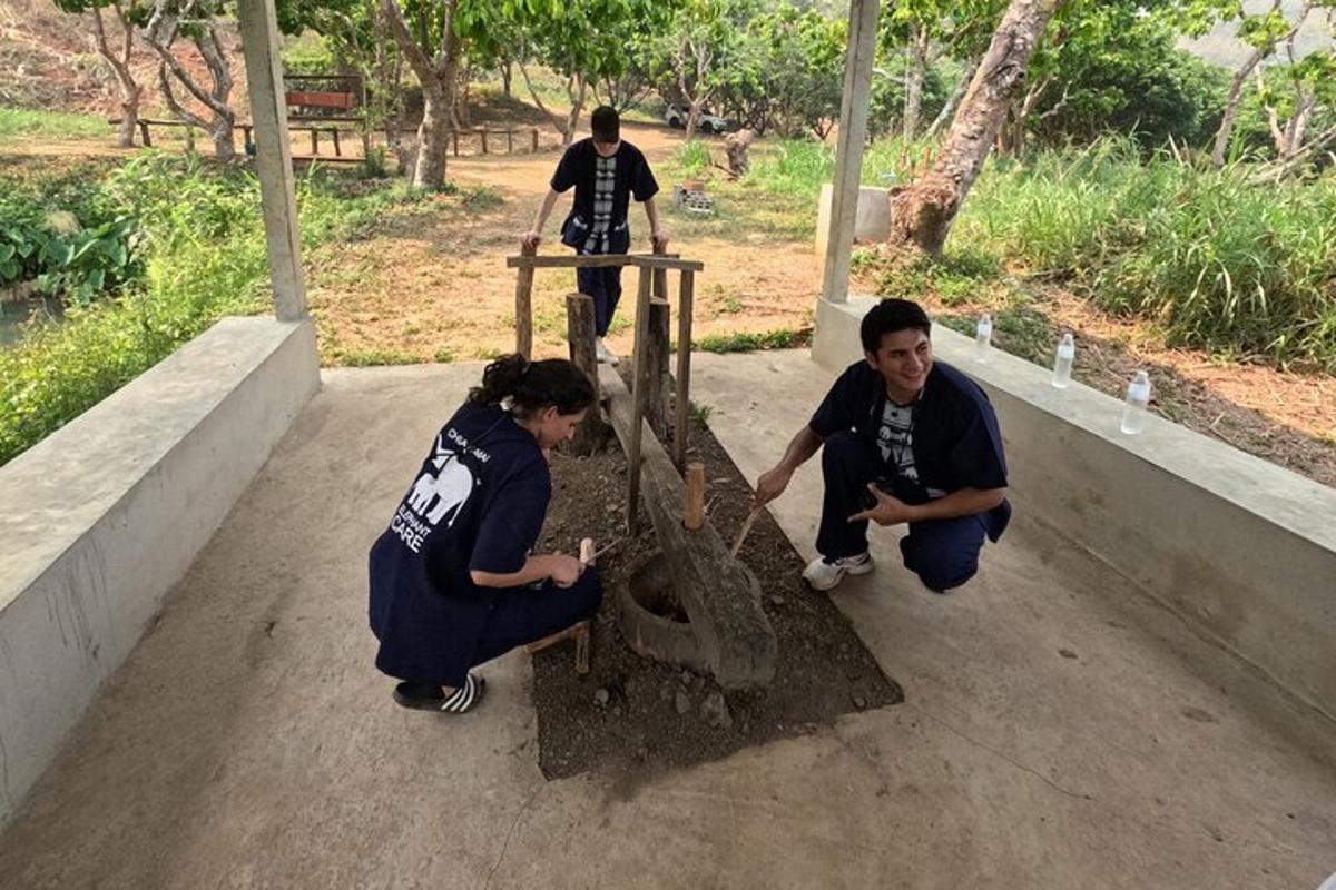 a group of people standing around a machine