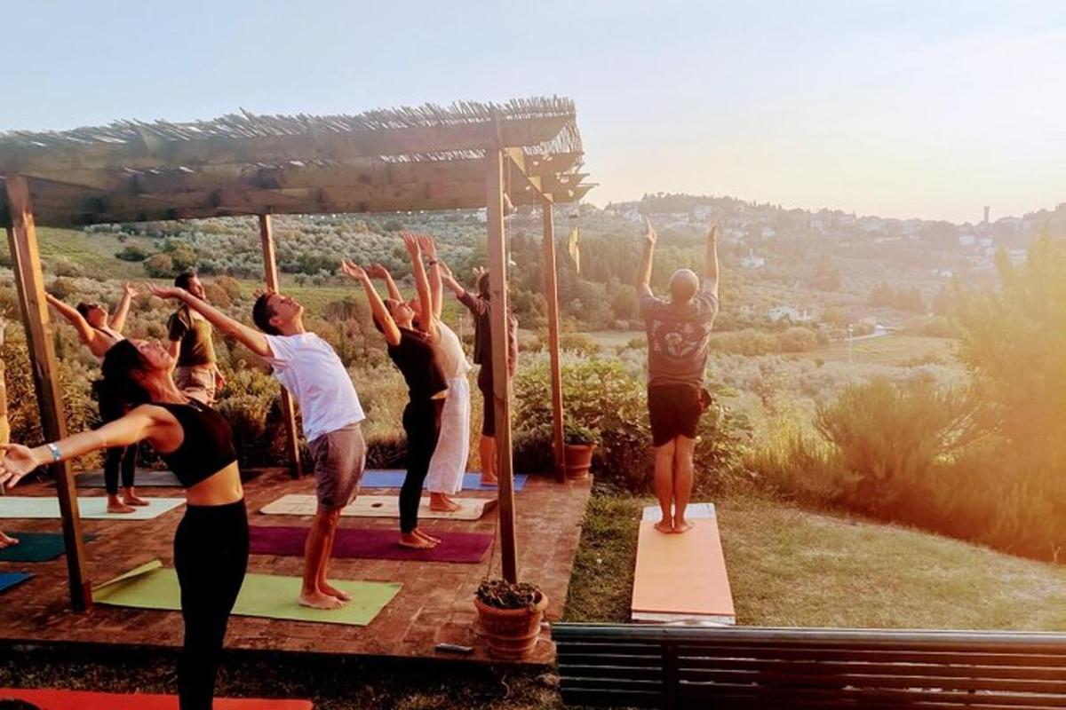a group of people doing yoga on a yoga deck