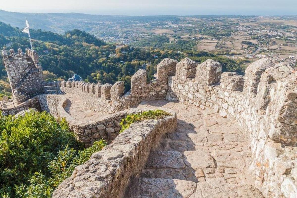 a stone wall on top of a mountain