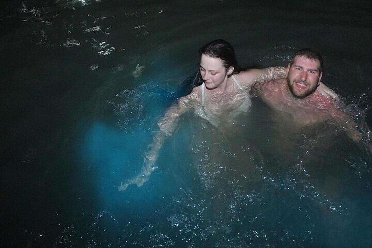 a man and a woman swimming in the water