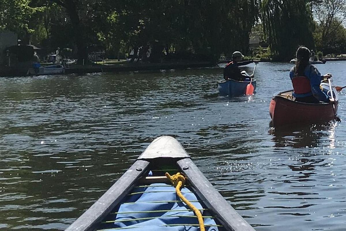 a group of people in kayaks on a river