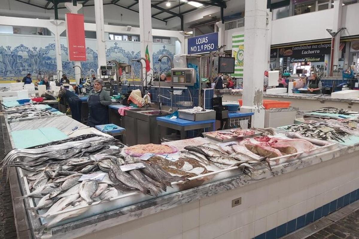 a fish market with many different types of fish on display