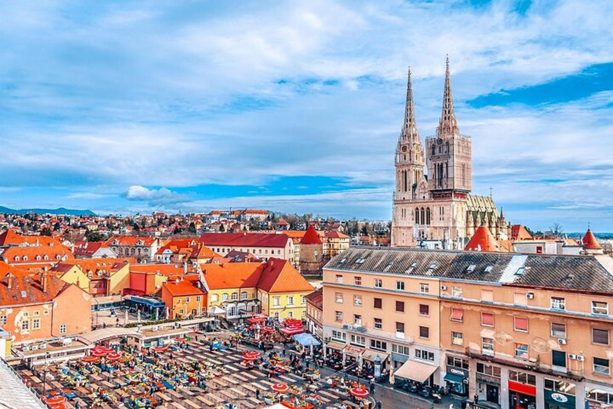 an aerial view of a city with a cathedral