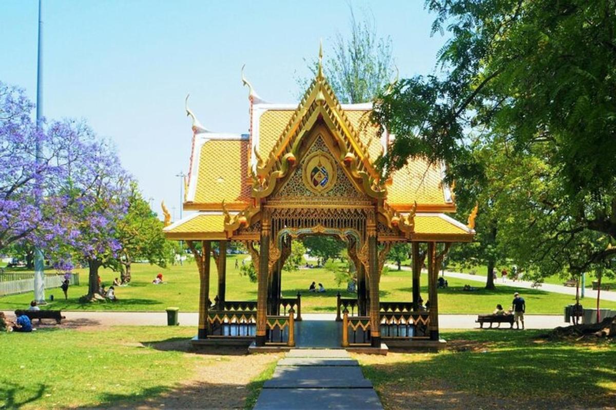 a gazebo in a park with people in it